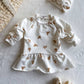 Baby ruffle dress in Teddy Bear